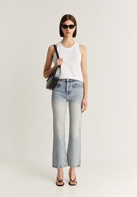 Scalpers BACK SEAM  - Flared jeans - light indigo