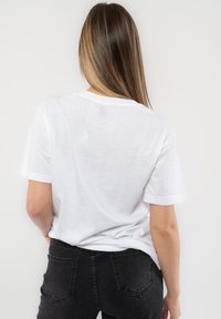 Paradiso Clothing BOB MARLEY DIAMANTE WINGS - Print T-shirt - white