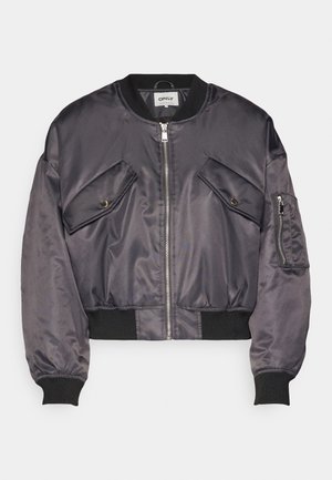 Bomber jacket in dark gray satin, featuring two chest pockets, a zip closure, ribbed cuffs, and a ribbed hem. Smooth, shiny texture.
