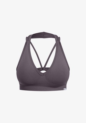 Stanik sportowy w głębokim odcieniu szarości, z dekoltem w kształcie litery V i skrzyżowanymi ramiączkami. Wykonany z elastycznej tkaniny o gładkiej, miękkiej fakturze.