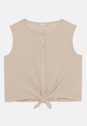 Beżowy krótki top wykonany z miękkiego materiału, z okrągłym dekoltem, z przodu zapinany na guziki i z przewiązanym wiązaniem u dołu.