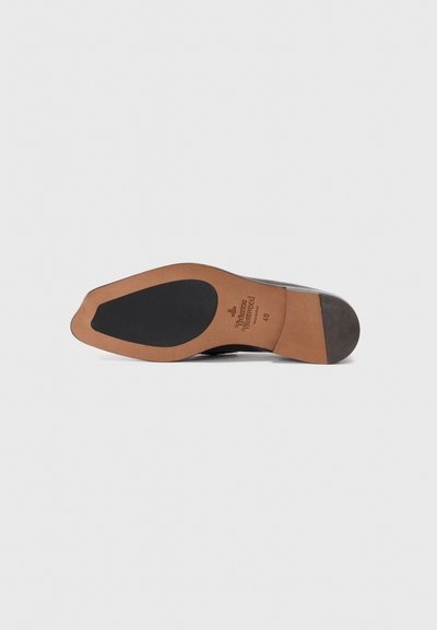 Black leather shoe sole with a smooth brown midsole, featuring a textured rubber insert and a brand logo embossed on the surface.