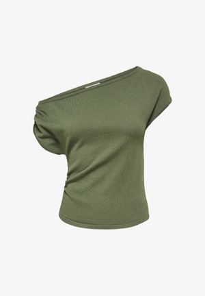 Haut vert à manches courtes et une épaule, avec un détail froncé sur un côté et une coupe légèrement ample.