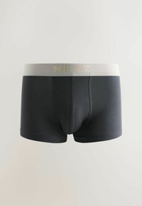 Boxers pour hommes noirs avec une ceinture grise arborant le nom de la marque "NEXT" en lettres dorées.