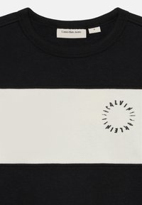 Calvin Klein Jeans SET UNISEX - Melegítő - black