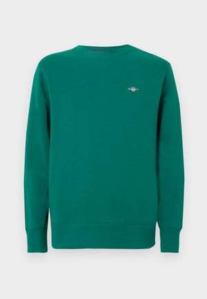 Groene sweatshirt van gestructureerde stof, met een ronde hals en geribbelde manchetten. Voorzien van een klein logo op de linkerborst.