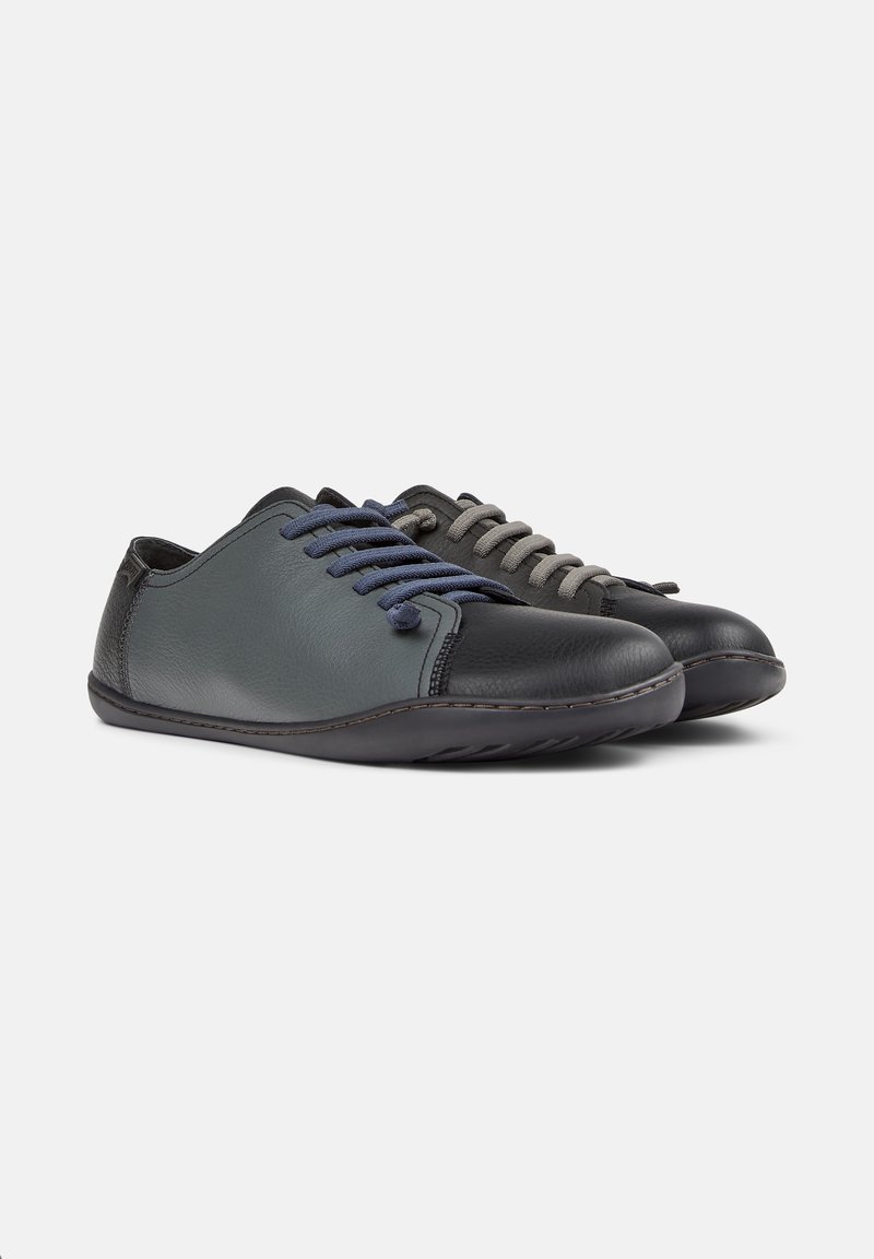 Leather shoes in grey and black, featuring round toes, fabric laces in blue and grey, and a flexible rubber sole with stitching details.