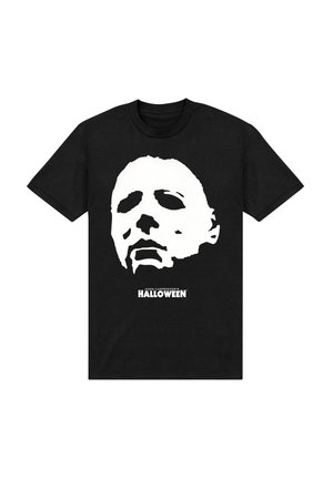 T-shirt nera con una grande grafica bianca di un volto mascherato, con il testo "JOHN CARPENTER'S HALLOWEEN" sottostante in grassetto.