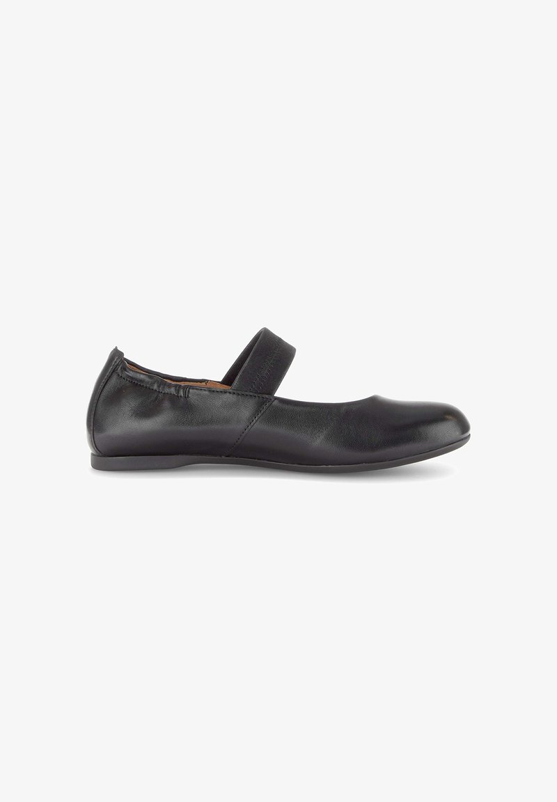 Black leather flat shoe with elasticized heel and single wide strap across the top, minimalist design, side view.