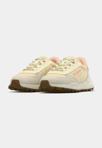 Lacoste sneakers in cream and light pink. Textured canvas and suede upper, rounded toe, lace-up closure, and rubber traction outsole.