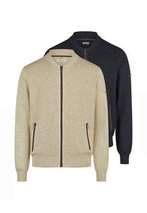 Due maglioni bomber da uomo con cerniera, uno beige davanti e uno nero dietro, entrambi con tasche laterali con zip e polsini e orli a coste.