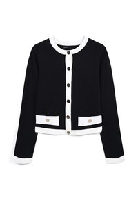 Gilet court noir avec des accents blancs, dotée d'un col rond, d'une fermeture à boutons à l'avant et de deux poches horizontales avec des boutons métalliques.