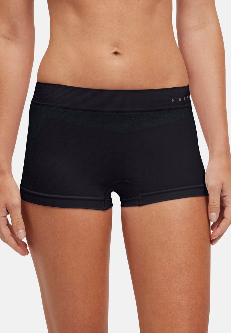 Shorts de sport noirs avec un design ajusté, une taille élastique et de subtils accents texturés. Fabriqués en tissu extensible et évacuant l'humidité.