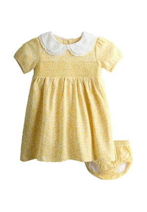 Vestido de bebé amarillo con estampado floral, cuello Peter Pan blanco con borde en forma de ondas, mangas cortas abullonadas, corpiño fruncido y bragas a juego.