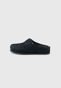 Black suede slip-on slipper with low heel and rounded toe, shown from the side on a white background.