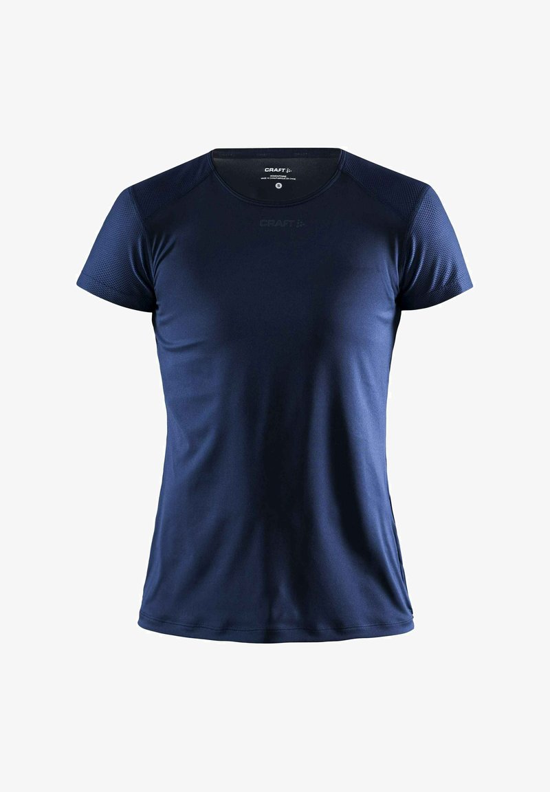 T-shirt de sport bleu marine à manches courtes avec tissu texturé sur les épaules, logo CRAFT centré sous l'encolure ronde.