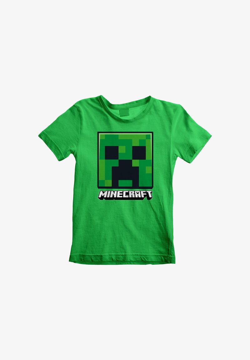Camiseta de algodón verde con un diseño pixelado de la cara de un Creeper en negro y verde, y el texto "MINECRAFT" debajo en letras blancas en negrita.