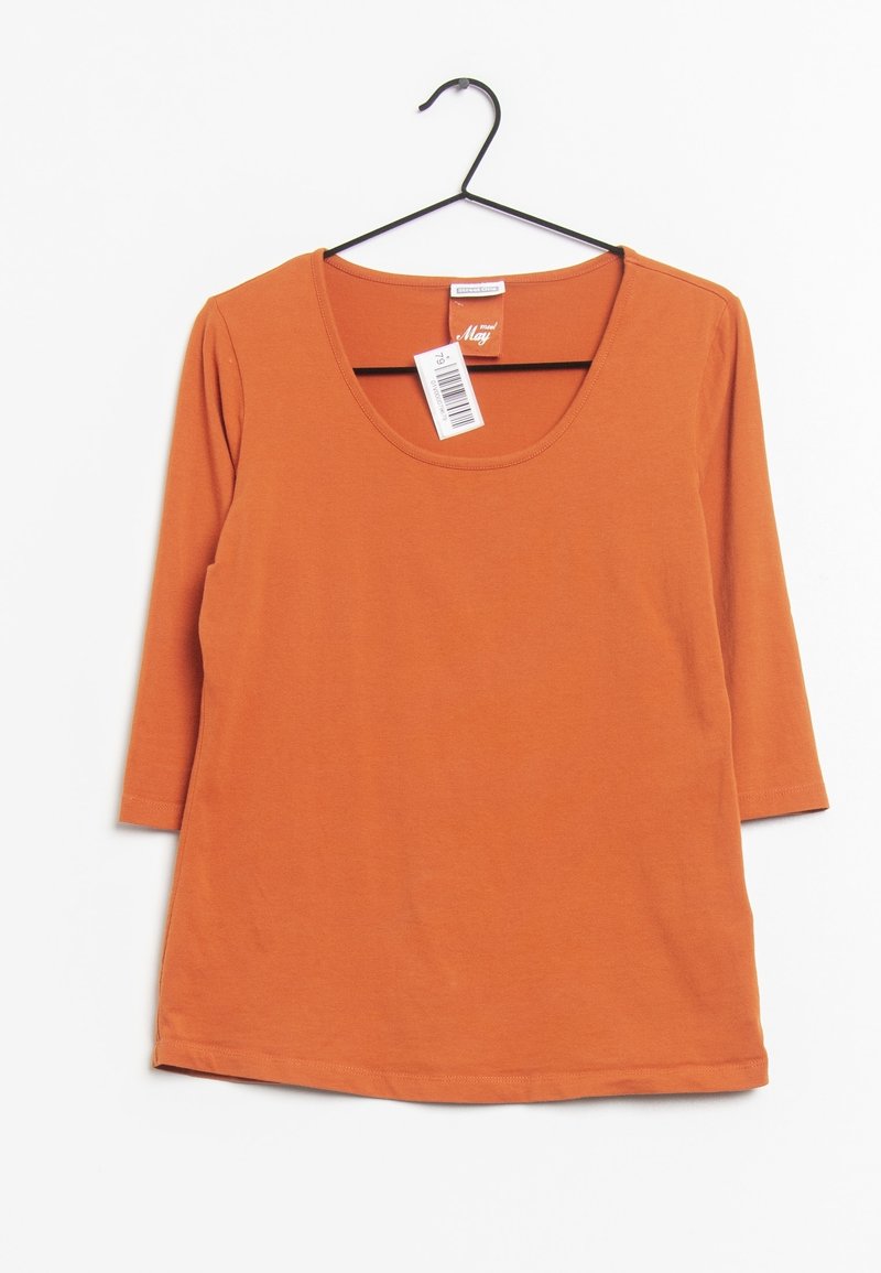 Rostorange, t-shirt med 3/4 ärmar i mjukt tyg, har en bred halsringning, rak fåll och en skötselvetenskap på baksidan av nacken.