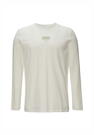 Langärmliges Shirt aus off-weißem Baumwollstoff mit rundem Ausschnitt und einem kleinen rechteckigen Logo-Label auf der Brust. Glatte Textur.