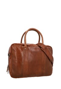 Brown leather bag with dual handles and adjustable strap. Features a rectangular shape, smooth texture, and subtle branding detail on the front.