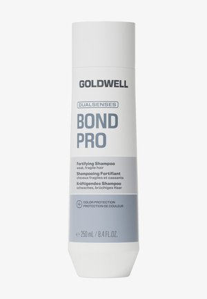 Witte fles Goldwell Dualsenses Bond Pro Fortifying shampoo voor zwak, breekbaar haar met kleurbehoud, inhoud 250 ml.
