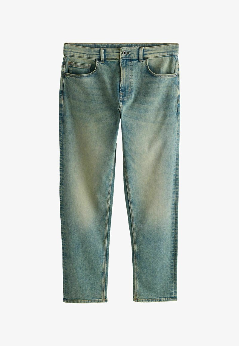 Jean slim bleu clair avec effet usé délavé, bouton et fermeture éclair à l'avant, et design à cinq poches.