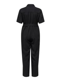 Combinaison noire à manches courtes avec col, ceinture cintrée à la taille et pantalon droit, vue de dos.