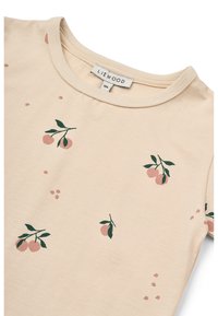 Light beige short-sleeve T-shirt featuring a crew neckline, printed peach motifs with green leaves, and a soft cotton texture.