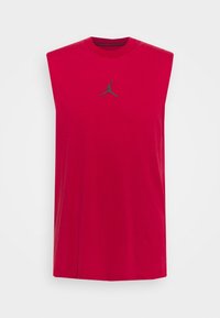 Maglietta senza maniche rossa corta in cotone, con un piccolo logo grigio di Jordan sul petto e un design a girocollo.