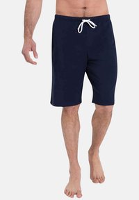 Shorts de bain bleu marine avec taille à cordon de serrage. Longueur au-dessus du genou et texture de tissu lisse. Pas de motifs ni de logos visibles.