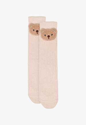 Knee-length beige socks with a textured bear face on the cuff, featuring embroidered eyes and ears in soft brown and cream colors.