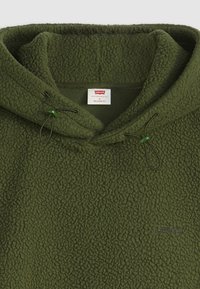 Olive green fleece hoodie with a textured surface, adjustable drawstring with green toggles, and a small embroidered Levi's logo.
