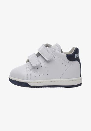 White leather sneaker with velcro straps, navy accents, perforated details on sides, and rubber sole. Minimalist design suitable for casual wear.