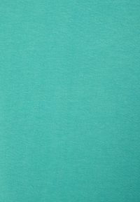 Turquoise fabric with a smooth texture, featuring a consistent pattern and lightweight material, suitable for casual wear or layering.