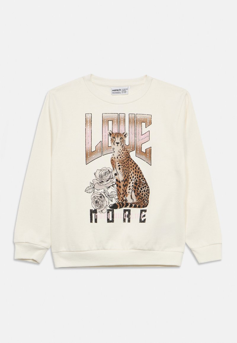 Sweatshirt crème avec un motif guépard entouré de roses, avec le texte « LOVE MORE » en motifs métalliques et noirs. Tissu en coton, poignets côtelés.