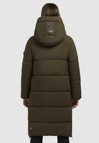 Padded long coat in dark olive green. Features a hood with reflective logo, horizontal seams, and a side logo accent near the hem.