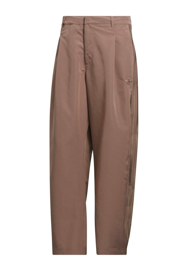 Brown loose-fit track pants with side stripes and a small embroidered logo on the upper thigh, featuring belt loops and a concealed front fastening.
