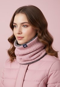 Knit infinity scarf in pink, featuring textured ribbing, complemented by a gray lining and a small logo tag, worn over a light pink jacket.
