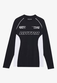 Long-sleeve shirt featuring a black body with white side panels. Graphics include "URTRN" and "FAST LANE" in white text, and checkered accents.