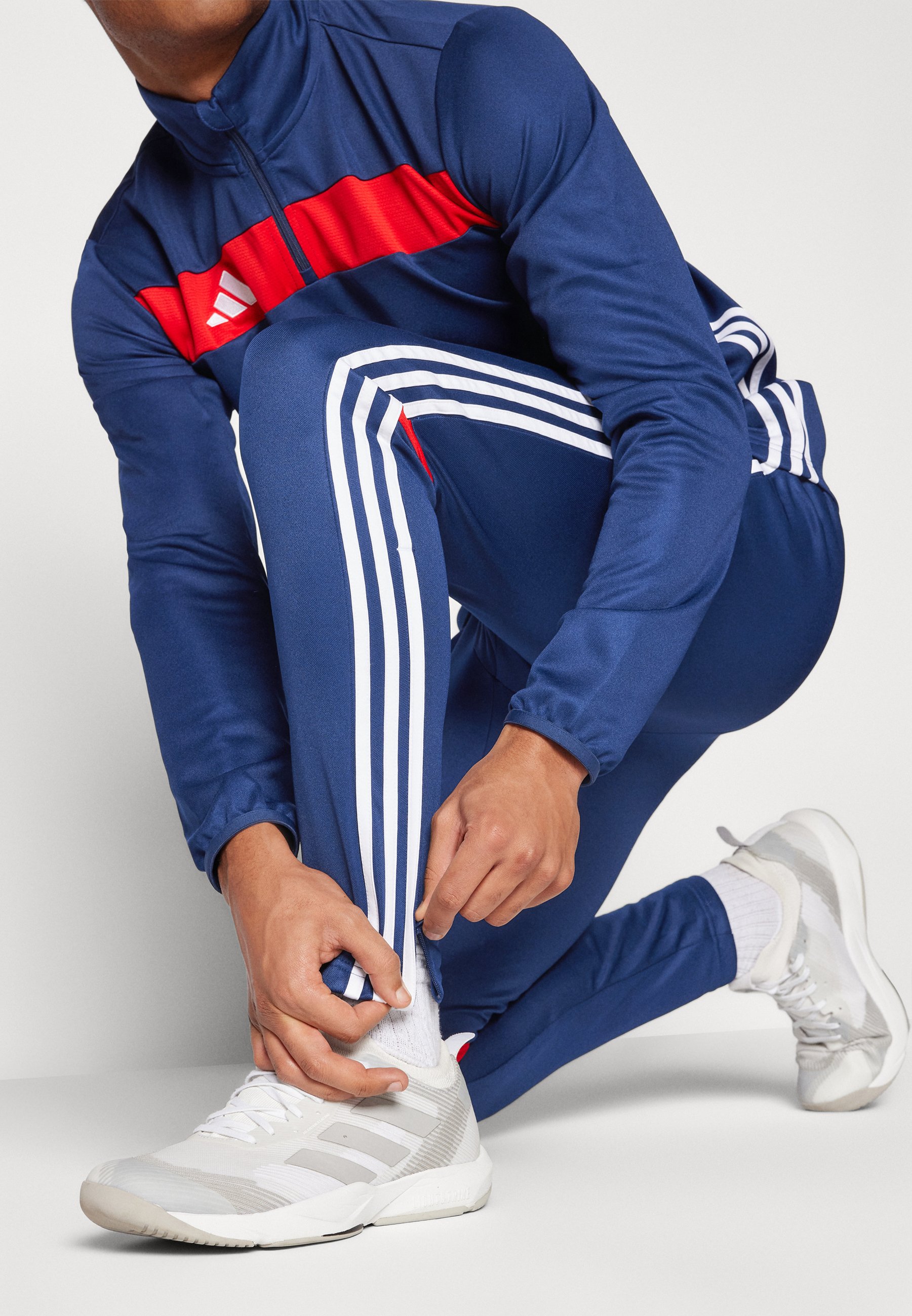 red and navy blue adidas