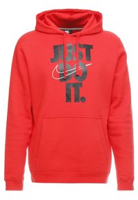 Sudadera con capucha roja y bolsillo tipo canguro, que presenta un gran gráfico negro con la frase "JUST DO IT" y el logo de Nike en un diseño de swoosh.