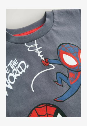 Graues Baumwoll-T-Shirt mit einem Cartoon-Spinnencharakter, roten Akzenten und weißem Schriftzug "Sei die Welt". Glatter Stoff und Rundhalsausschnitt.