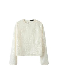 Hvid langærmet bluse med en tekstureret overflade dækket af pailletter. Rund halsudskæring og en nøglehul-lukning bagpå. Glat stof. Boxy pasform.