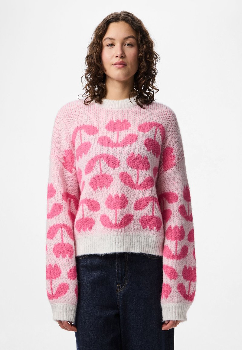 Pink and white knitted sweater with floral pattern, wide sleeves, round neck, and ribbed hem. Soft texture, casual fit.