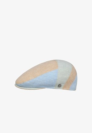Flat cap with a patchwork design in beige, light blue, and light gray fabric with a small round metal emblem on the side.
