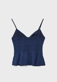 Haut court sans manches bleu marine avec fines bretelles réglables, corsage froncé élastique et ourlet évasé.