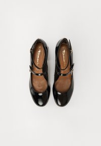 Chaussures Mary Jane en cuir verni noir avec double sangle et boucles dorées, taille 37, vues de dessus sur un fond blanc.