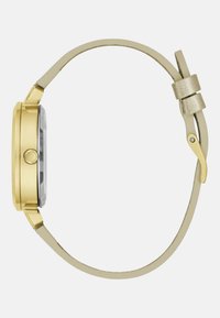 Orologio da polso color oro con cassa rotonda, quadrante in vetro trasparente e cinturino in pelle beige chiaro con un accento metallico.