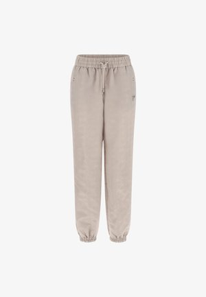 Lys beige joggers med et subtilt mønster, elastisk talje, snor og manchetter ved anklerne. Lavet af et glat, blødt materiale.