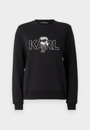 Sudadera negra de algodón con un gráfico en la parte delantera de una figura de dibujos animados y la palabra "KARL" en letras blancas en negrita.